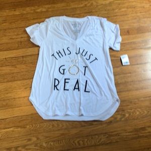 White ‘this just got real’ T-shirt. NWT.